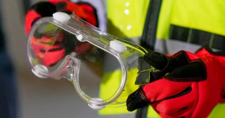 worker holding ppe