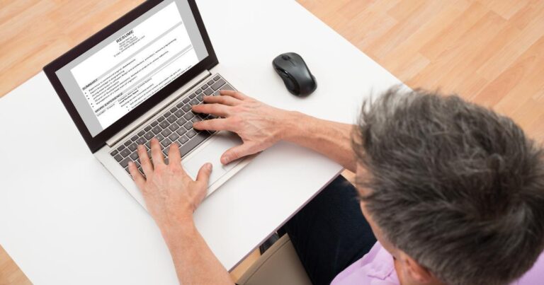 man updating resume