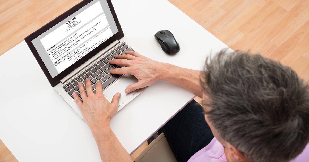 man updating resume