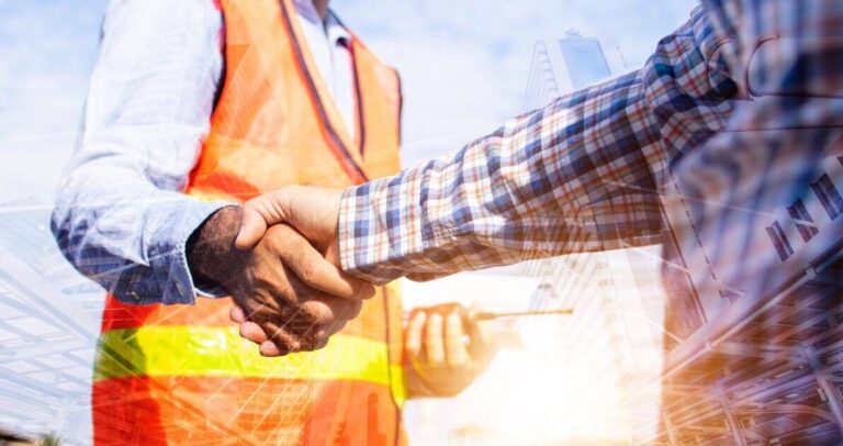 Oregon contractor and construction worker shaking hands on a job site