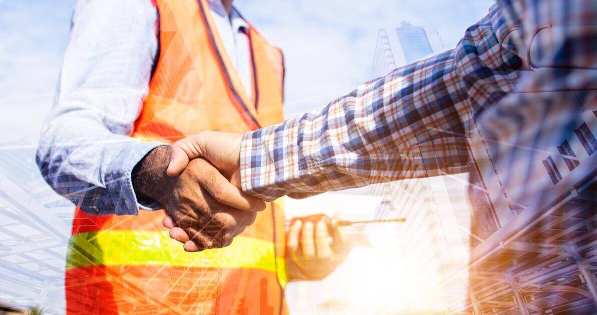 Oregon contractor and construction worker shaking hands on a job site