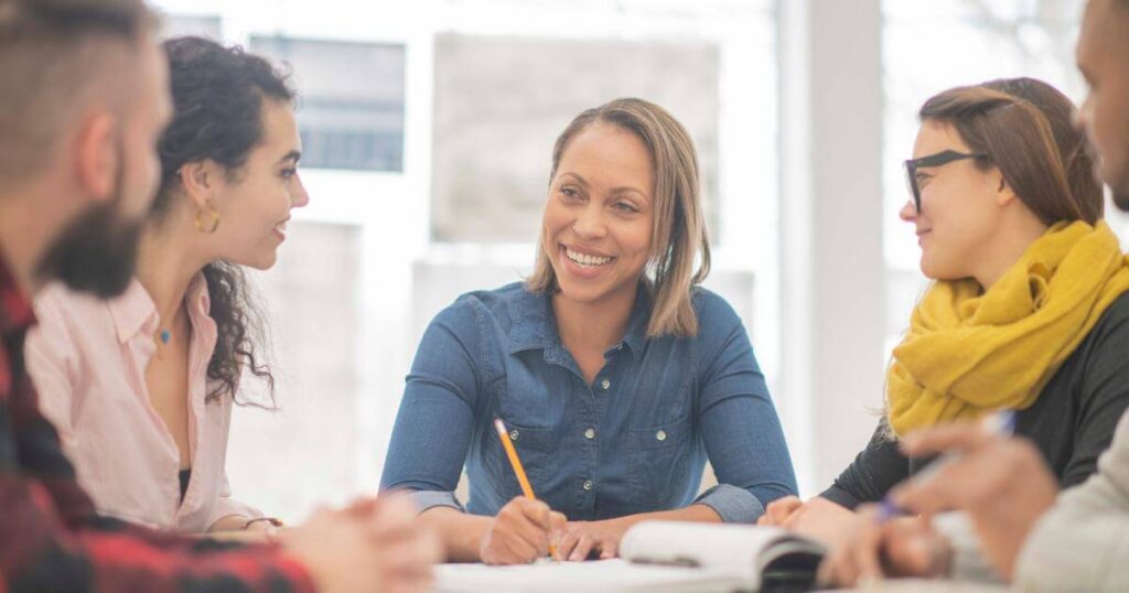 Diverse team collaborating in a meeting — what attracts candidates to a company culture