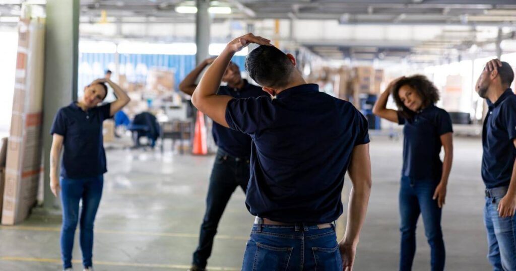 manager leading team in morning stretches