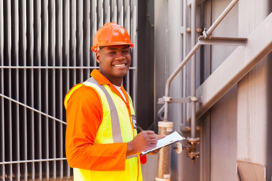 male african electrical worker in front of transformer