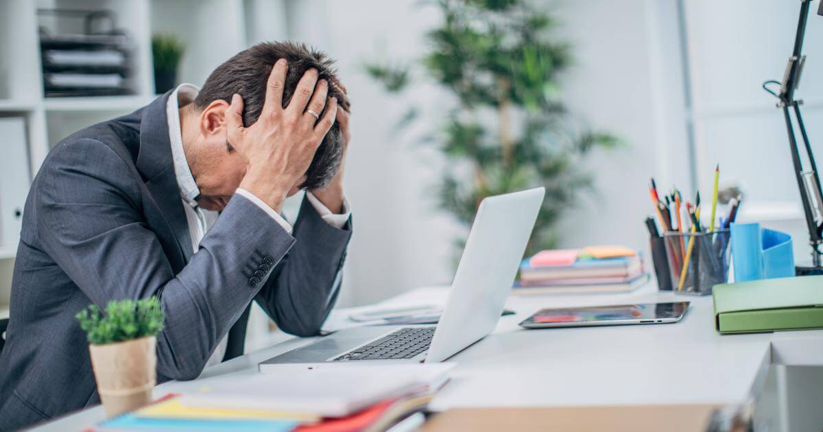 frustrated manager in front of computer