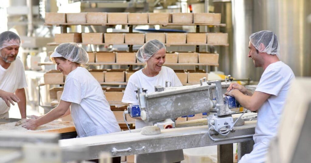 productive happy food manufacturing workers