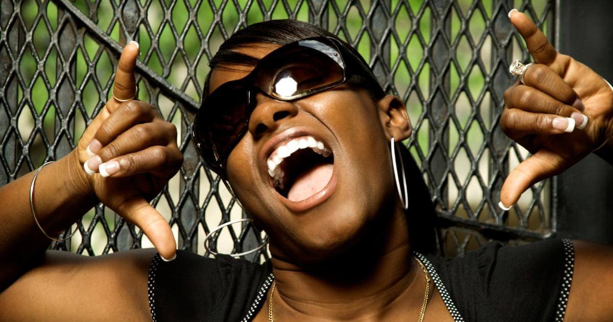 woman with shades acting like rock star